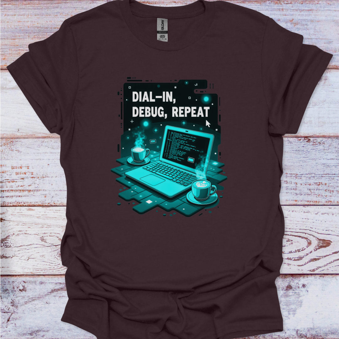 Brown t-shirt with a graphic of a laptop and text 'Dial-In, Debug, Repeat' on a wooden surface.