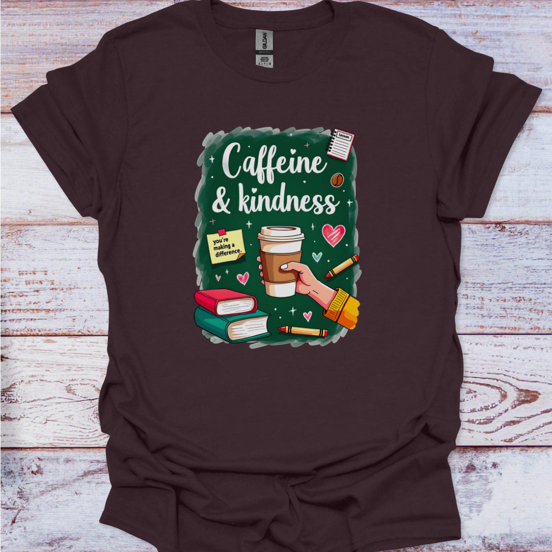 Brown t-shirt with 'Caffeine & Kindness' graphic design on a wooden surface