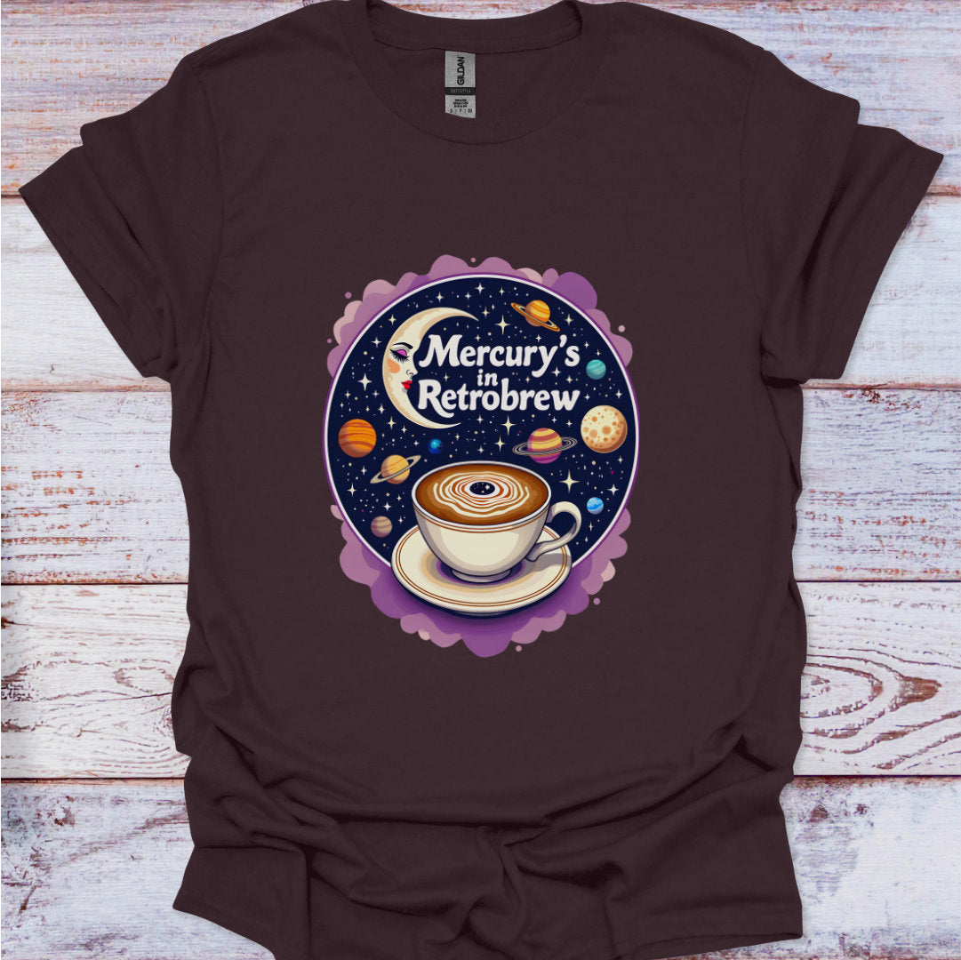 Brown t-shirt with a coffee-themed graphic on a wooden surface