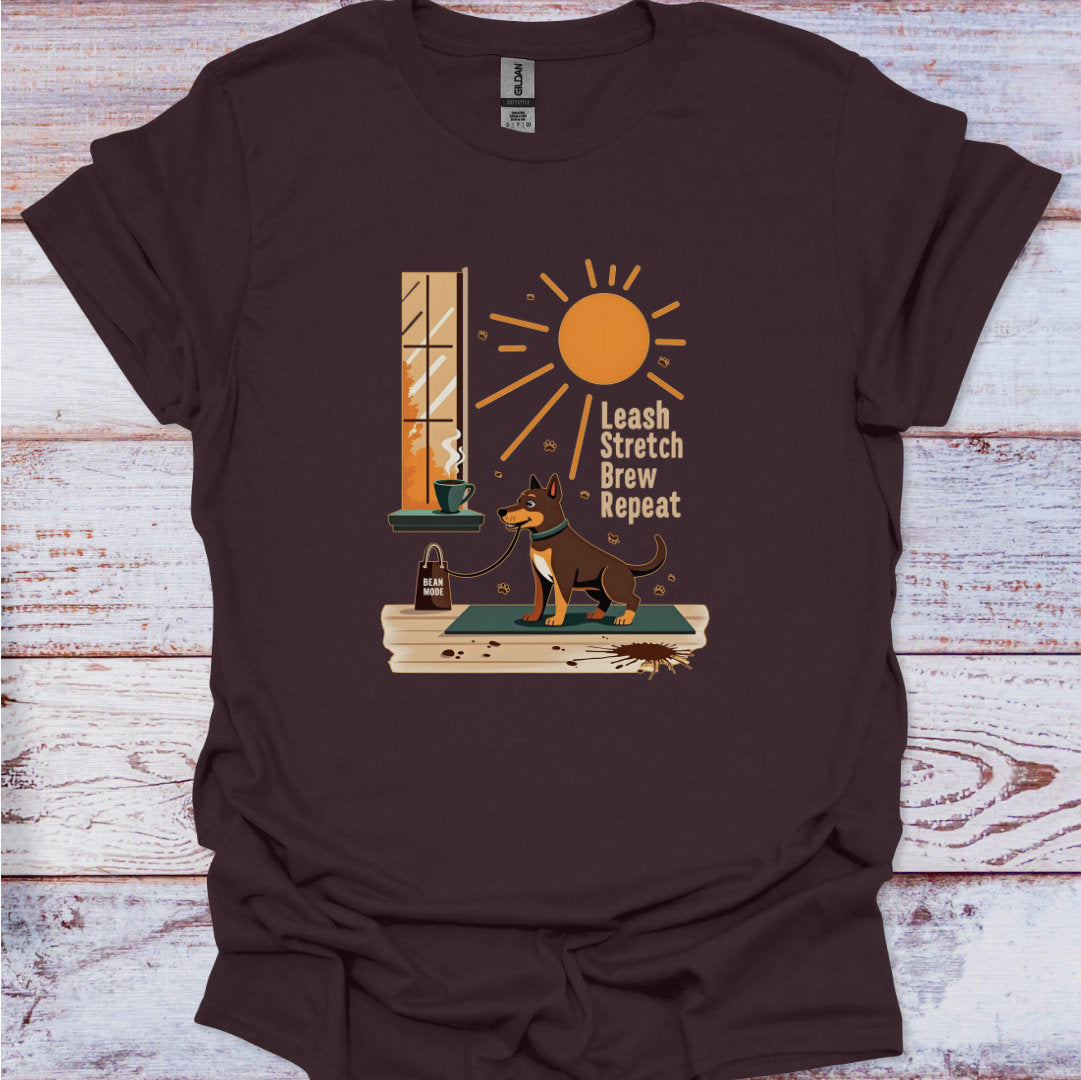 Brown t-shirt with a dog graphic and text on a wooden surface