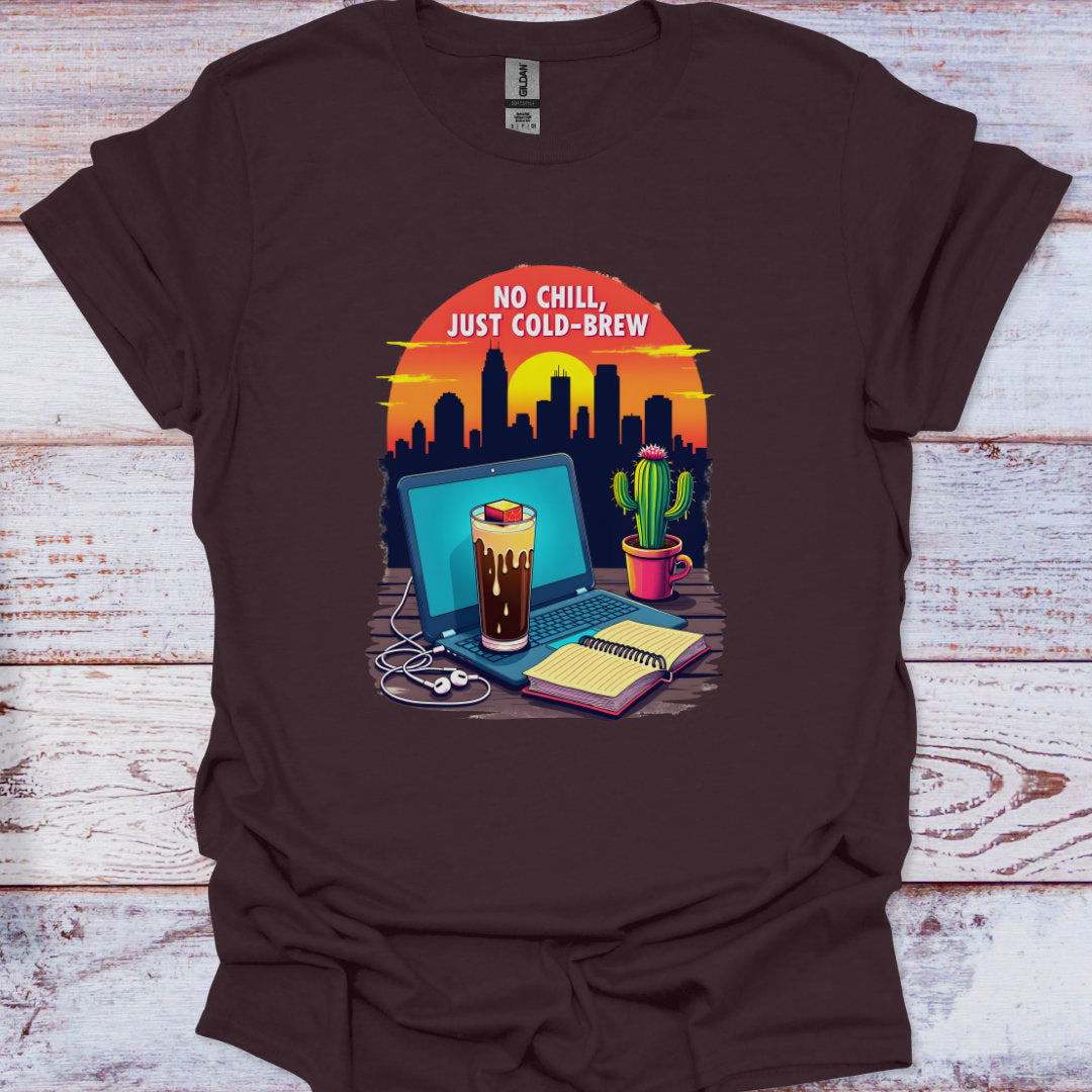 Brown t-shirt with a graphic of a laptop, coffee, and cactus with 'No Chill, Just Cold Brew' text on a wooden surface.