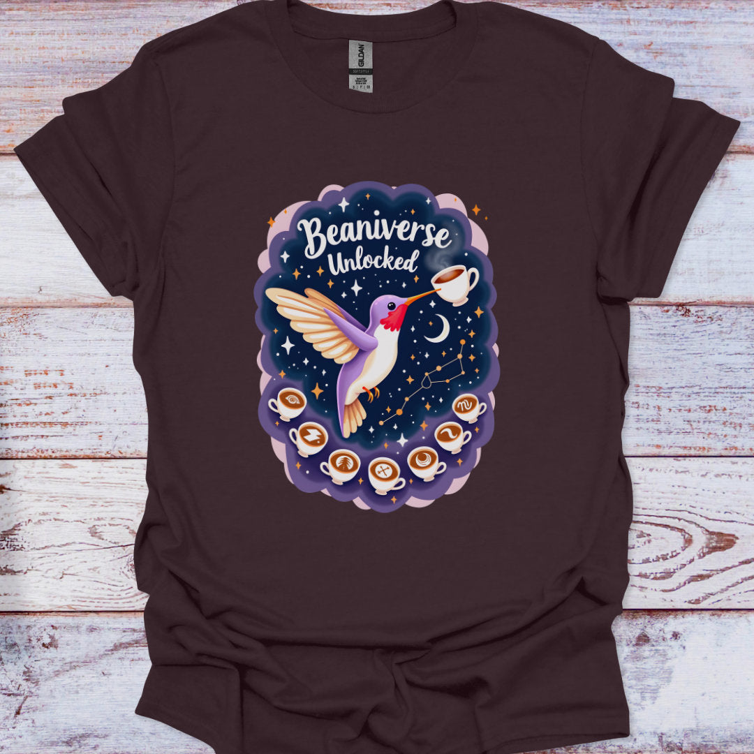 Brown t-shirt with a colorful graphic of a bird and coffee cups on a wooden surface