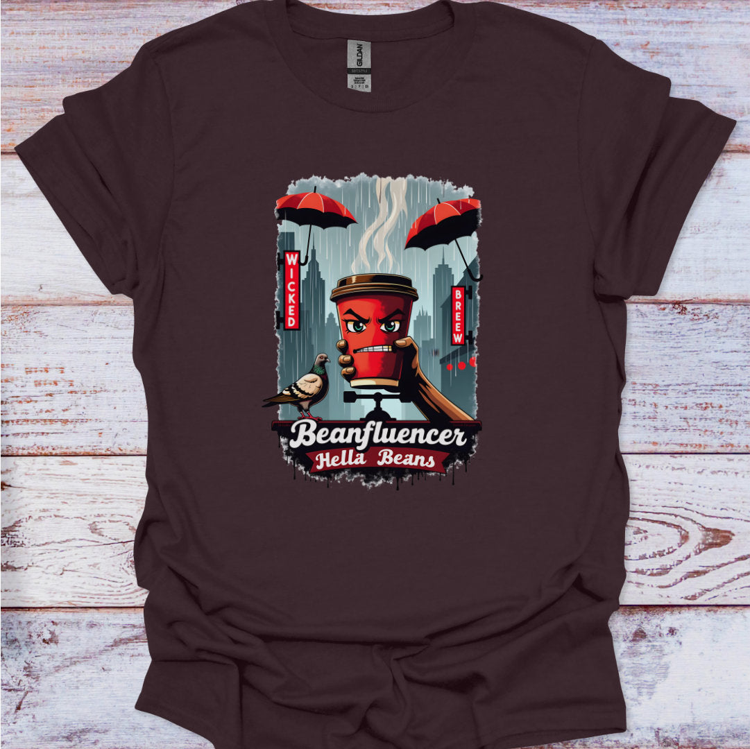Brown t-shirt with a graphic design of a coffee cup and text on a wooden surface