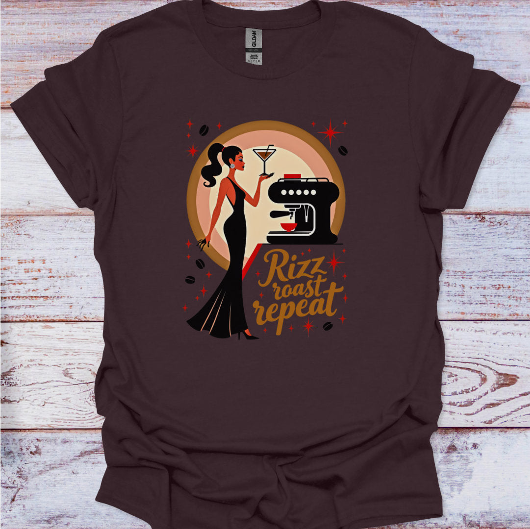Brown t-shirt with a graphic design of a woman, coffee machine, and text 'Rizz roast repeat' on a wooden surface.