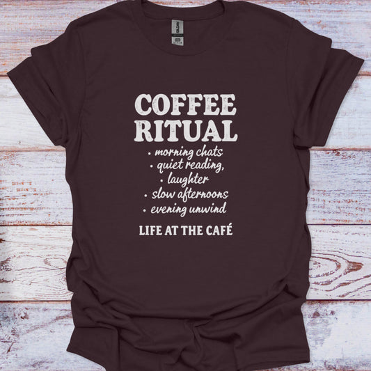 Brown t-shirt with white text on a wooden surface