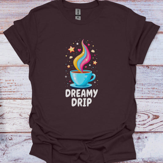 Brown t-shirt with a colorful coffee cup graphic and 'Dreamy Drip' text on a wooden surface.