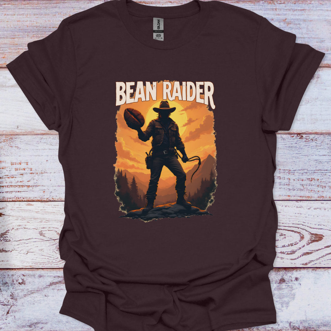 Brown t-shirt with 'Bean Raider' graphic design on a wooden surface