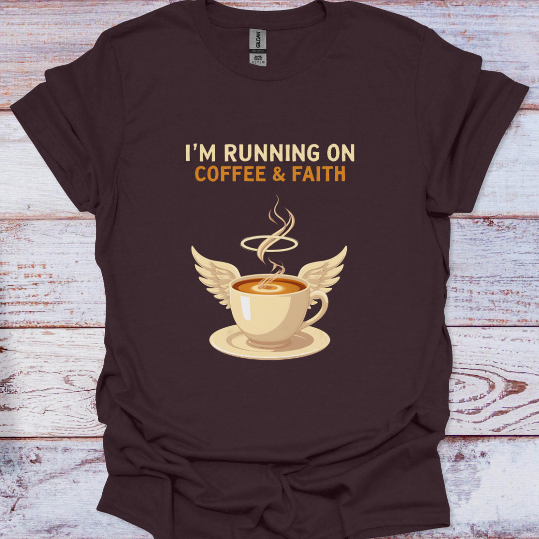 Brown t-shirt with a coffee cup graphic and text 'I'm running on coffee & faith' on a wooden surface.