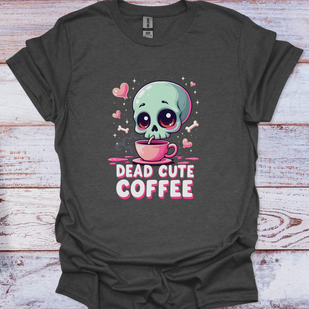 Gray t-shirt with a cartoon skull holding a coffee cup and 'Dead Cute Coffee' text on a wooden surface.