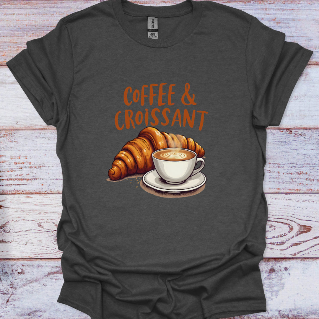 Dark gray t-shirt with 'Coffee & Croissant' graphic on a wooden surface