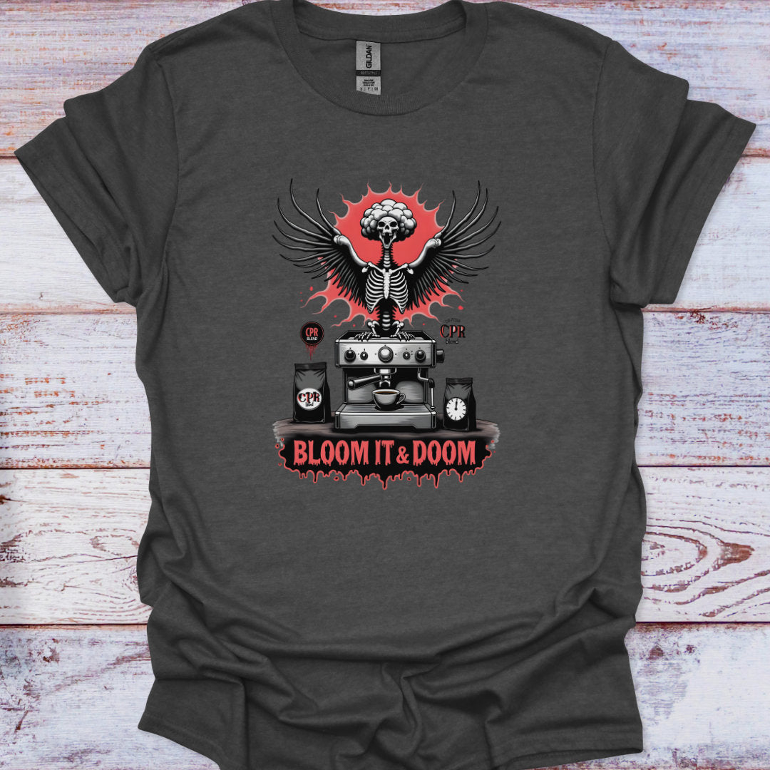 Dark gray t-shirt with a graphic design featuring a skeleton, coffee machine, and text 'Bloom It & Doom' on a wooden surface.