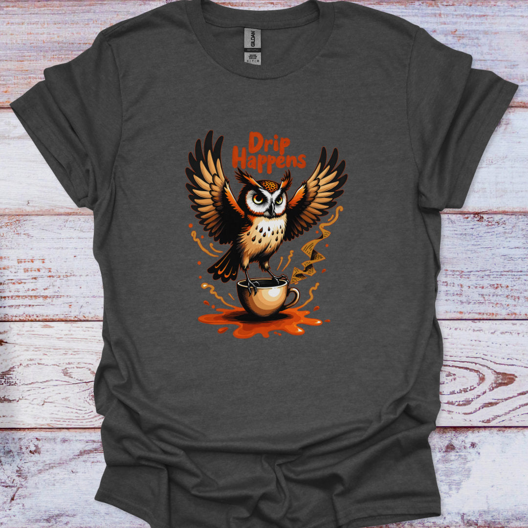 Gray t-shirt with an owl holding a coffee cup and 'Drip Happens' text on a wooden surface