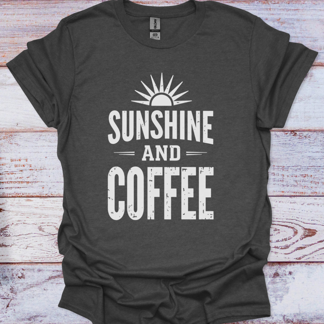 Dark gray t-shirt with 'Sunshine and Coffee' text on a wooden surface