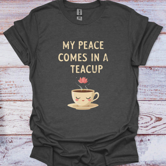 Dark gray t-shirt with a teacup graphic and text on a wooden surface