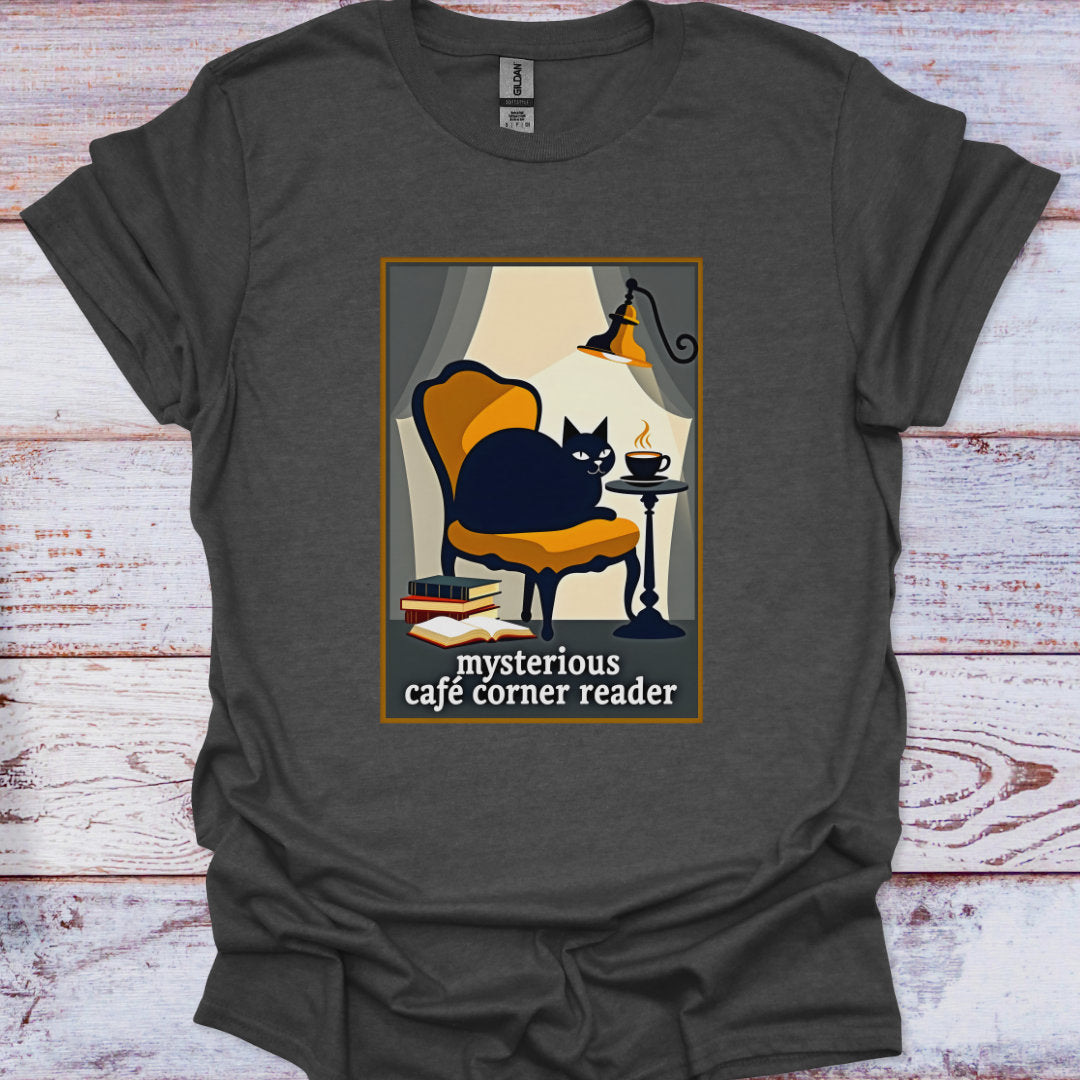 Gray t-shirt with a graphic of a cat in a cafe and text 'mysterious cafe corner reader' on a wooden surface.