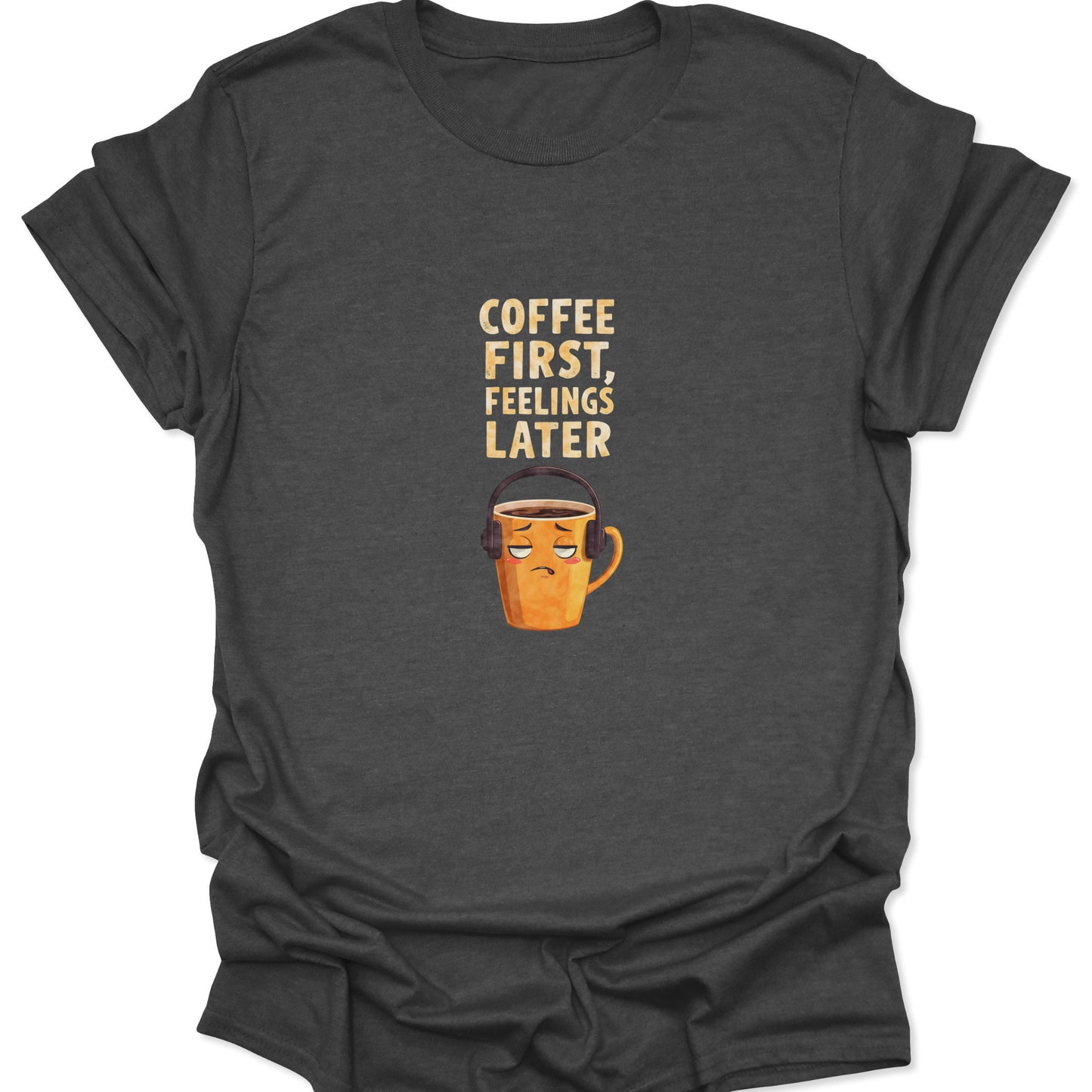Dark Heather t-shirt featuring grumpy mug with headphones and "Coffee First, Feelings Later" text, funny introvert style.