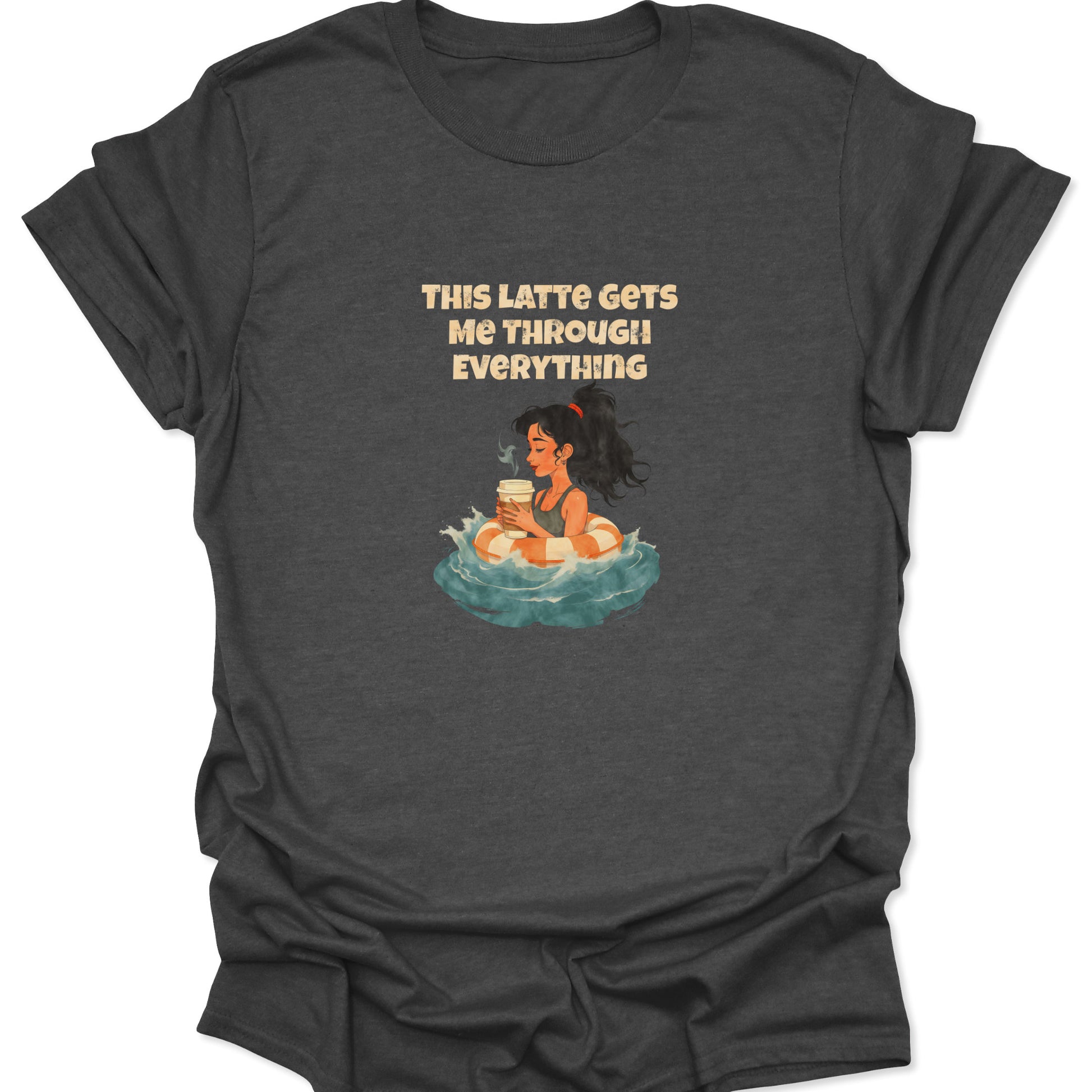 Dark heather gray t-shirt with a cross-niche, existential coffee survival design. Shows a woman in a lifesaver floating, with the text hook: "THIS LATTE GETS ME THROUGH EVERYTHING."