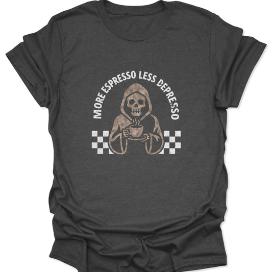 Front view of a dark gray t-shirt featuring a beige skeleton Grim Reaper holding a coffee cup with the text "MORE ESPRESSO LESS DEPRESSO" in a distressed font.