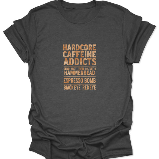 Charcoal gray t-shirt featuring a bronze and cream-colored vertical text design listing high-caffeine drinks like "Espresso Bomb" and "Redeye" for the ultimate coffee lover.