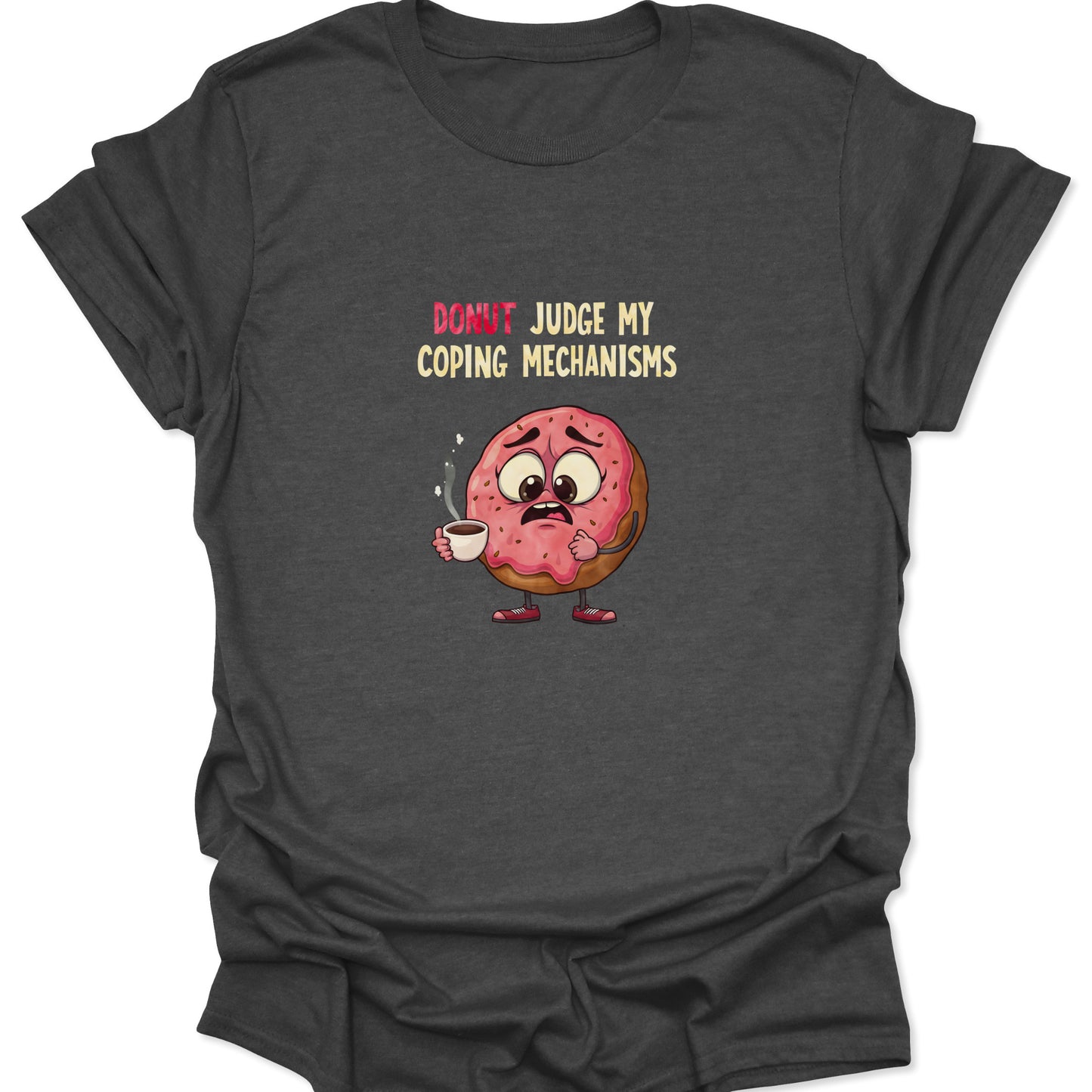 Graphic t-shirt on a dark heather gray background featuring a nervous pink-frosted donut holding a steaming coffee cup with the text "Donut Judge My Coping Mechanisms."