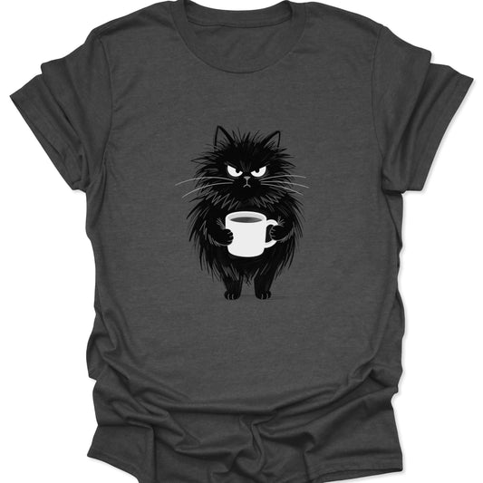 A grumpy, unkempt black cat clutching a mug of coffee on a dark heather gray textured t-shirt.