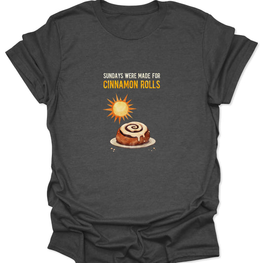 Heather gray t-shirt displaying a foodie graphic of a cinnamon roll on a plate under a bright sun.