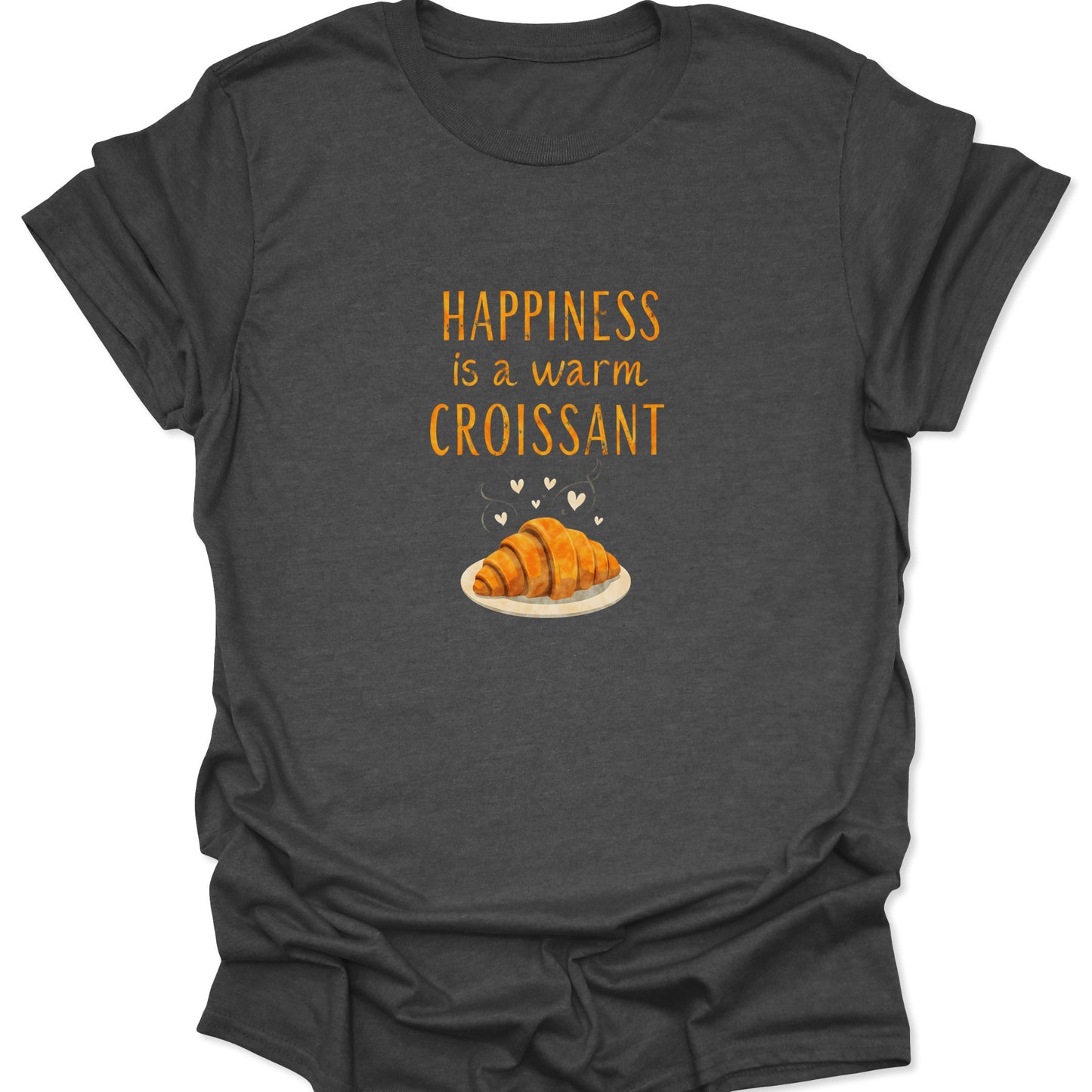 Heather gray apparel showcasing a detailed graphic of a perfect croissant pastry with steam and hearts, accompanied by the motivational text "Happiness is a warm Croissant."
