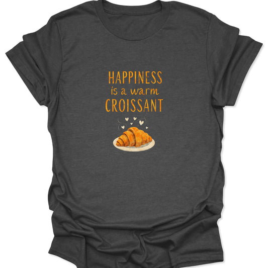 Heather gray apparel showcasing a detailed graphic of a perfect croissant pastry with steam and hearts, accompanied by the motivational text "Happiness is a warm Croissant."