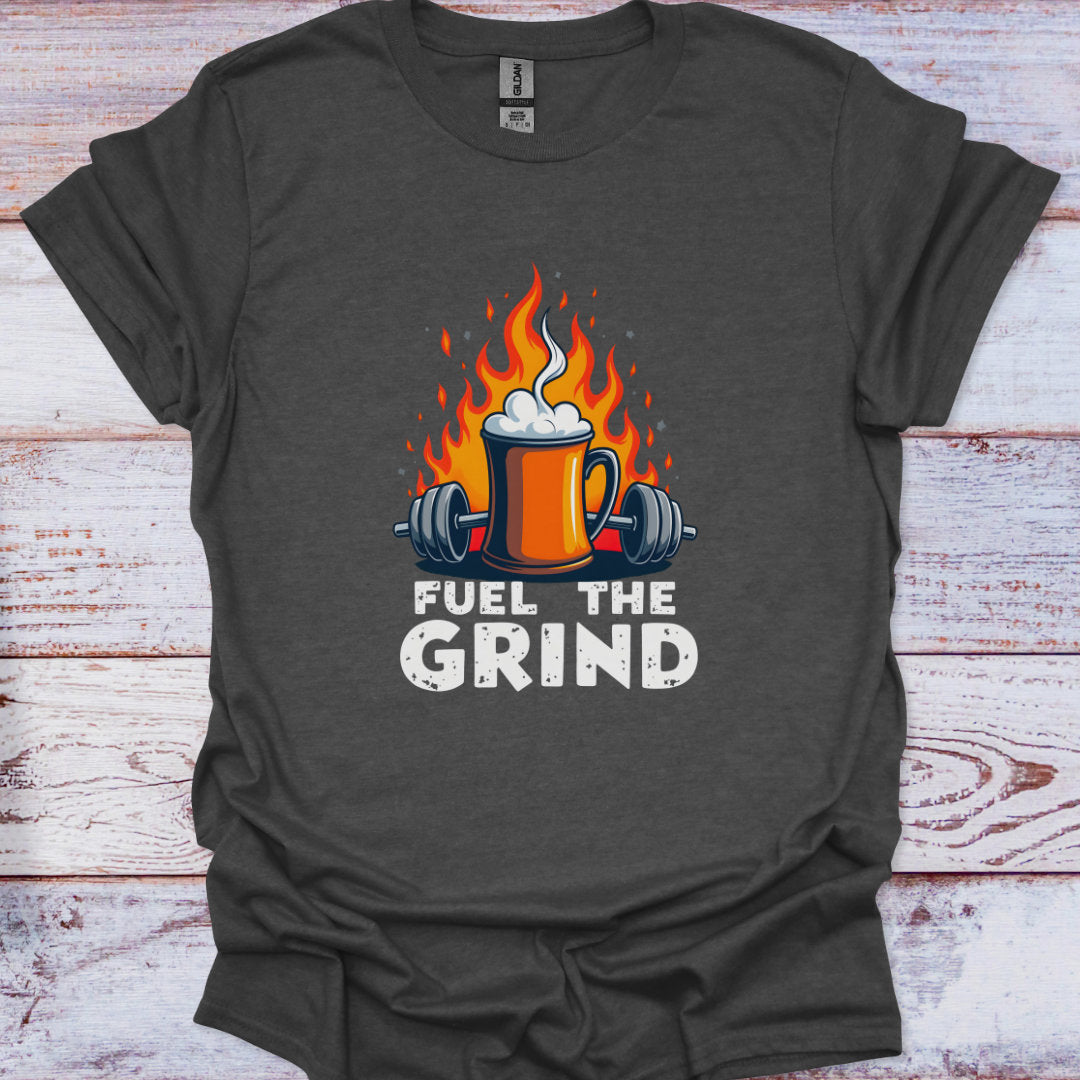 Dark gray t-shirt with 'Fuel the Grind' graphic design featuring a mug with flames and weights on a wooden background.