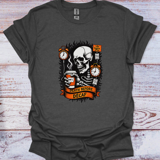 Gray t-shirt with a skull holding a coffee cup and text 'Death Before Decaf' on a wooden surface.
