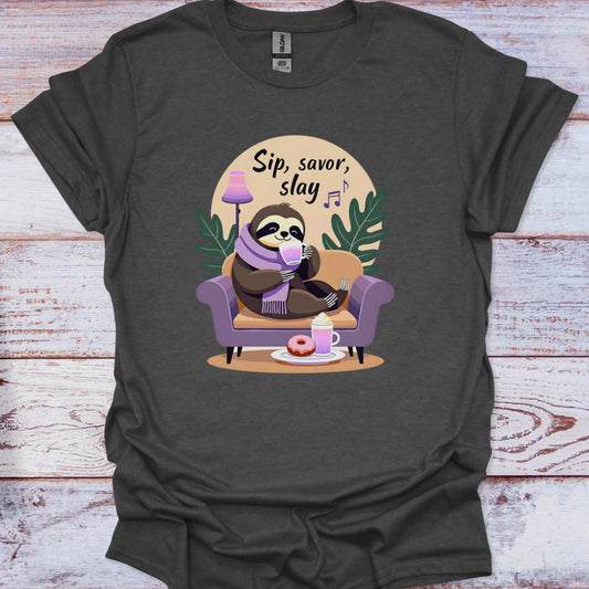 Dark gray t-shirt with a sloth graphic and 'Sip, savor, slay' text on a wooden surface