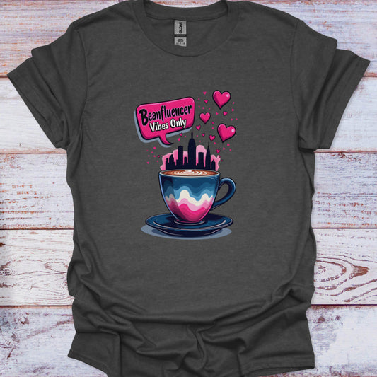 Dark gray t-shirt with a colorful coffee cup graphic and 'Beanfluencer Vibes Only' text on a wooden surface.