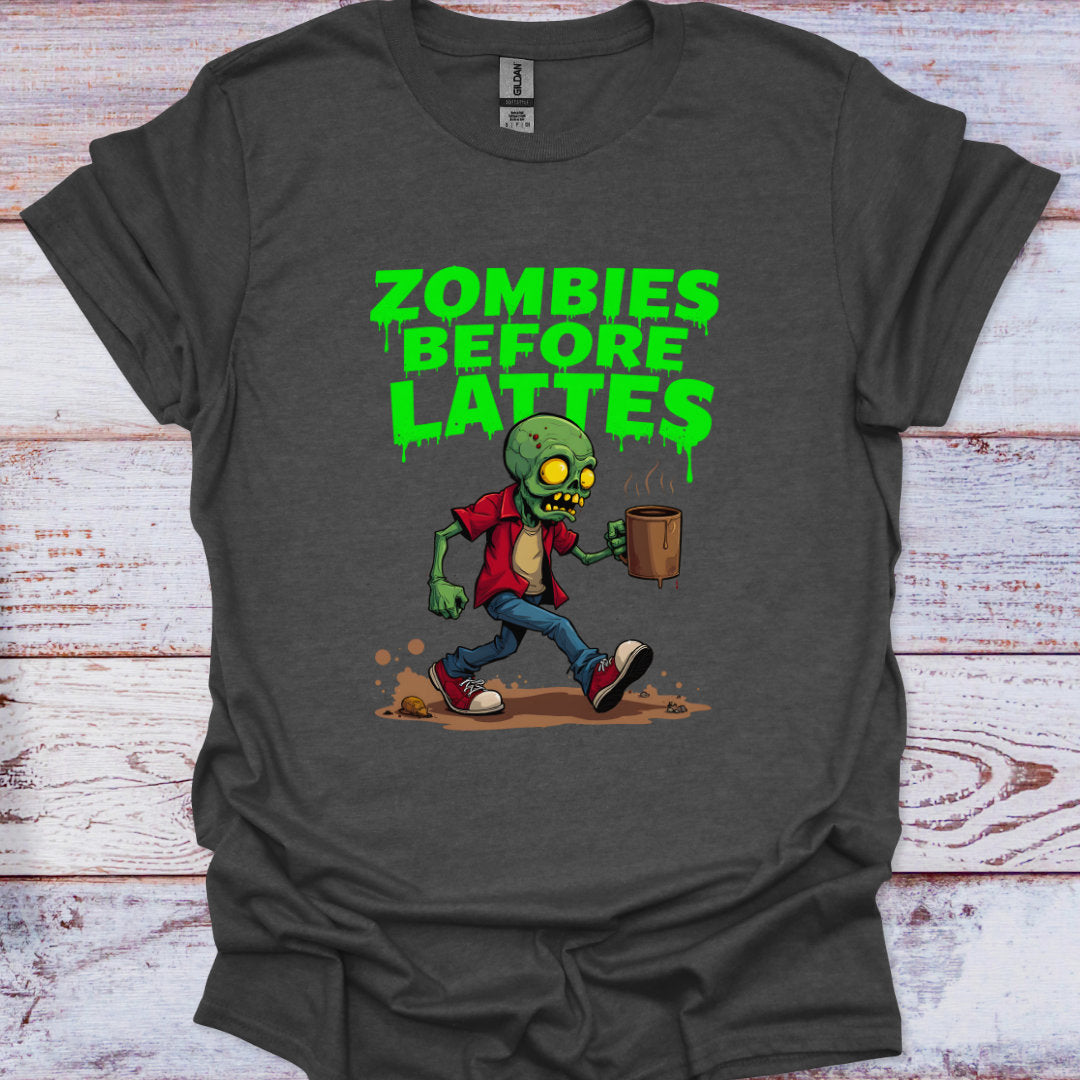 Gray t-shirt with a zombie graphic and 'Zombies Before Lattes' text on a wooden surface