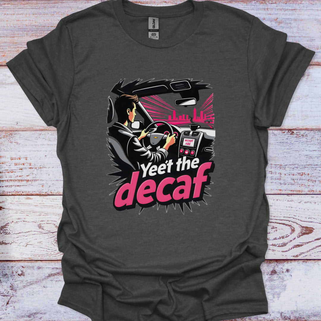 Gray t-shirt with a graphic design of a person driving a car and text 'Yeet the decaf' on a wooden surface.
