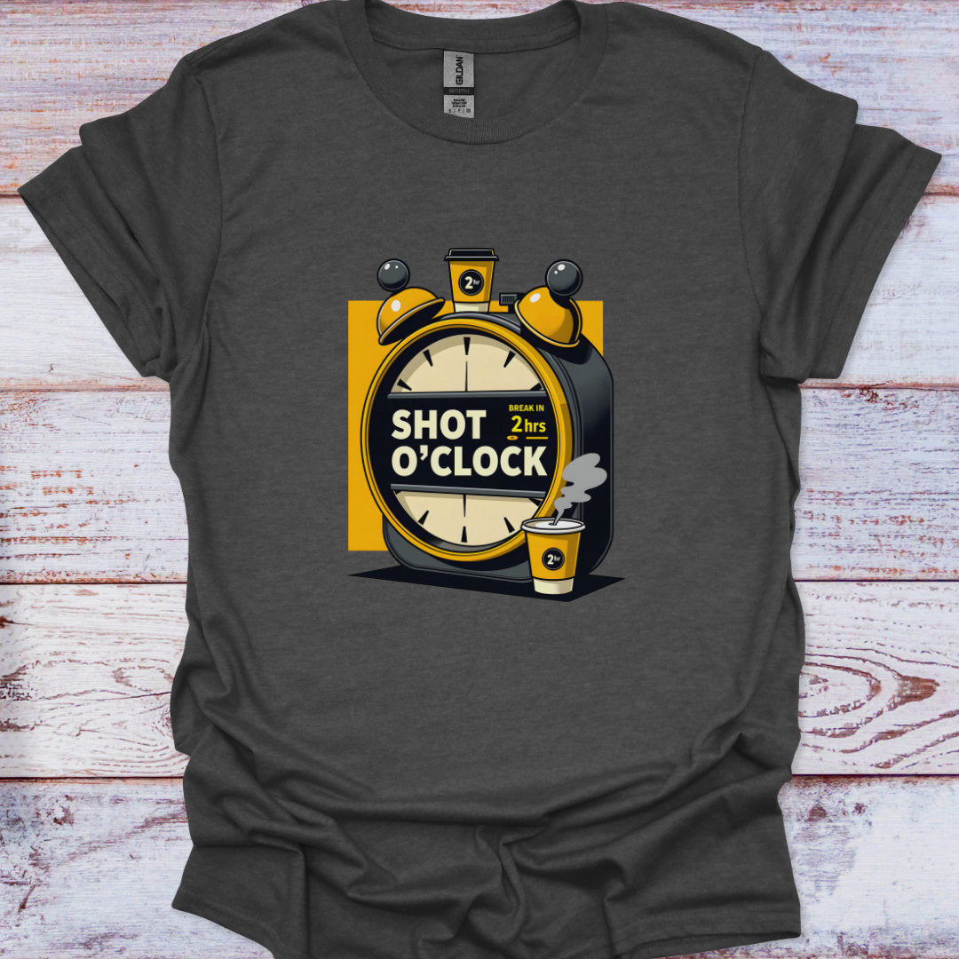 Gray t-shirt with a graphic design of an alarm clock and shot glass on a wooden surface