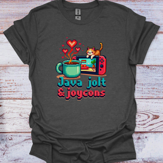 Dark gray t-shirt with a graphic of a coffee mug, game console, and cat, with text 'Java jolt & joycons' on a wooden surface.