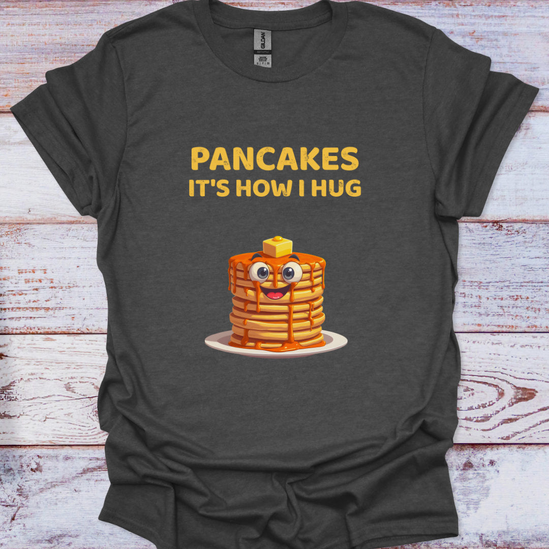 Dark gray t-shirt with cartoon pancakes and text on a wooden surface