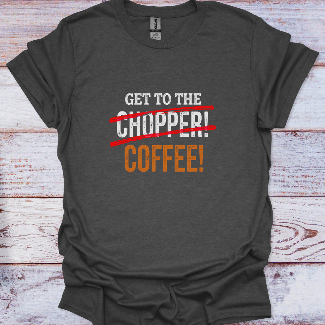 Dark gray t-shirt with humorous text design on a wooden surface