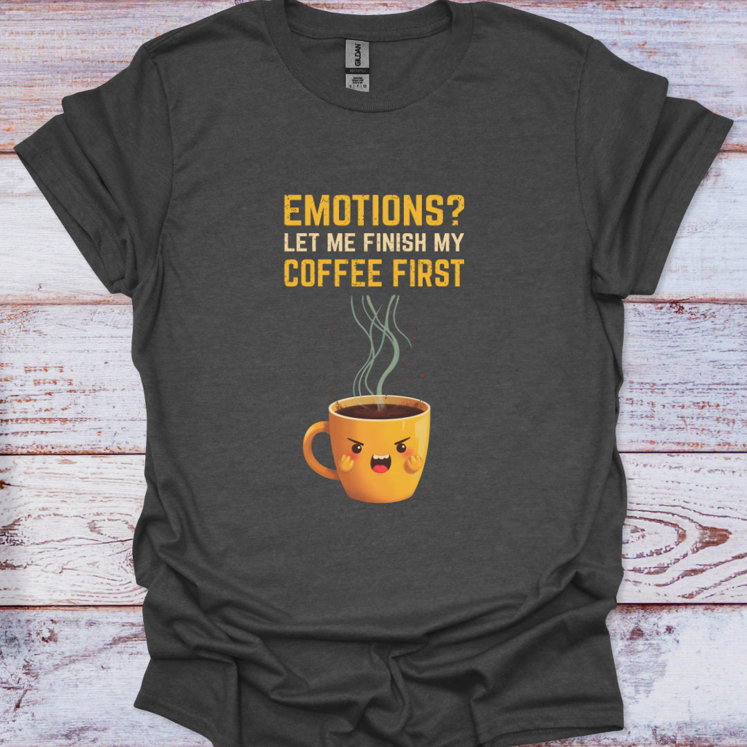 Dark gray t-shirt with a coffee cup graphic and text on a wooden surface