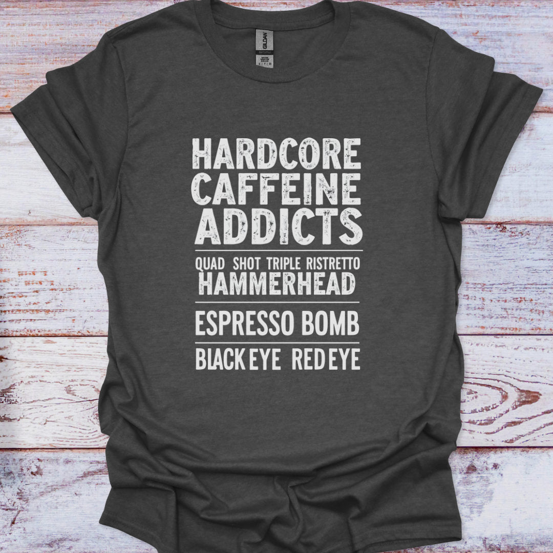 Dark gray t-shirt with white text on a wooden surface