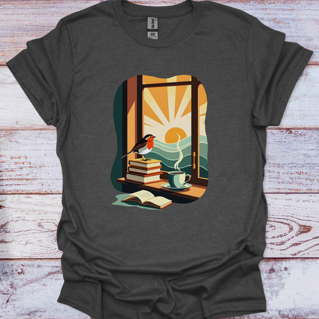 Dark gray t-shirt with a colorful graphic of a window, books, a cup, and a bird on a wooden surface.