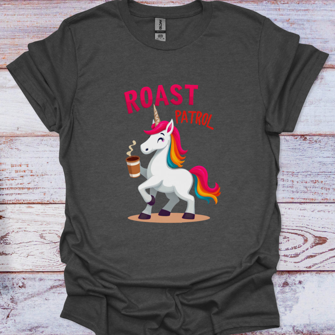 Dark gray t-shirt with a colorful unicorn graphic and 'Roast Patrol' text on a wooden surface.