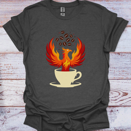 Dark gray t-shirt with a phoenix rising from a coffee cup design on a wooden surface