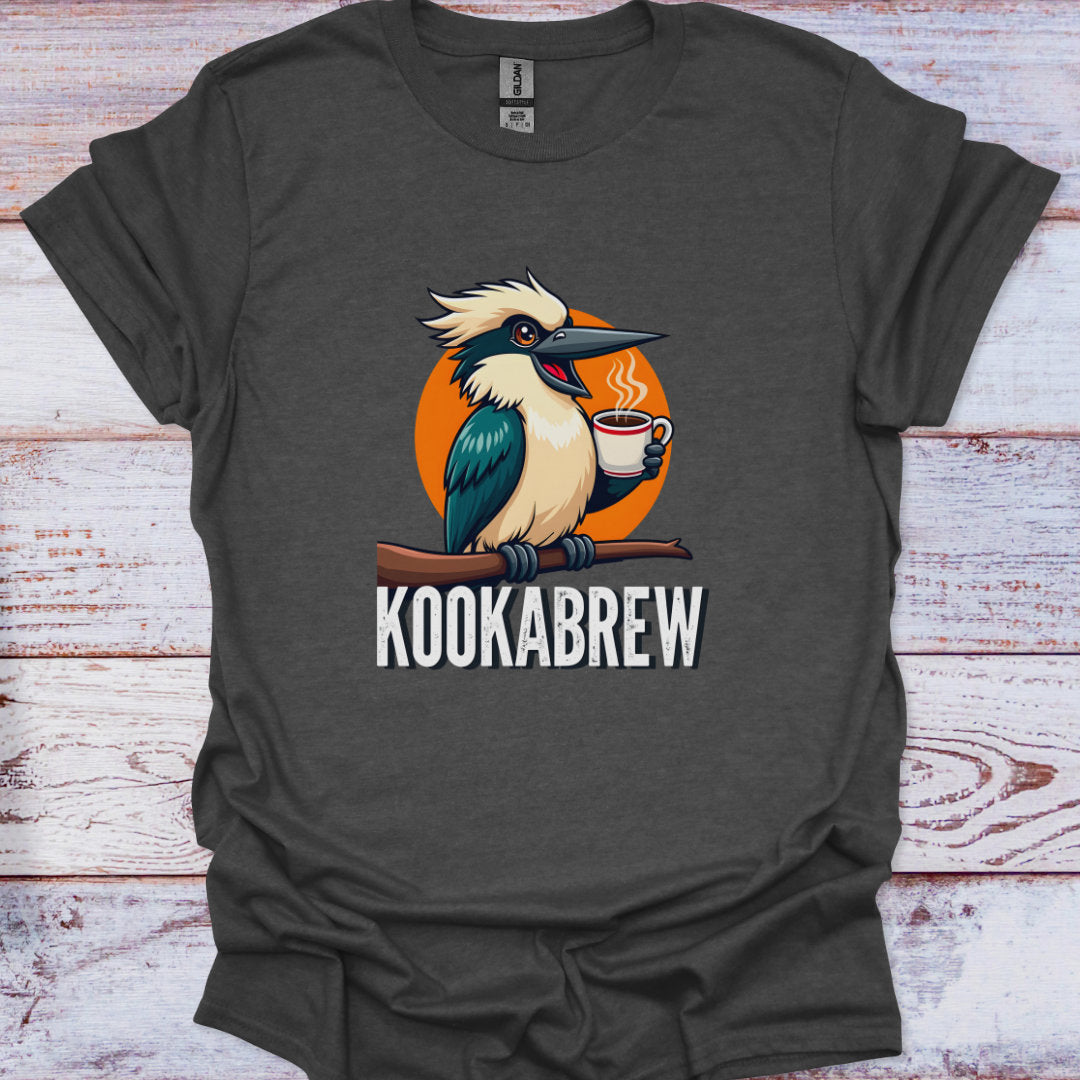Dark gray t-shirt with a kookaburra holding a coffee cup graphic and 'KOOKABREW' text on a wooden surface.