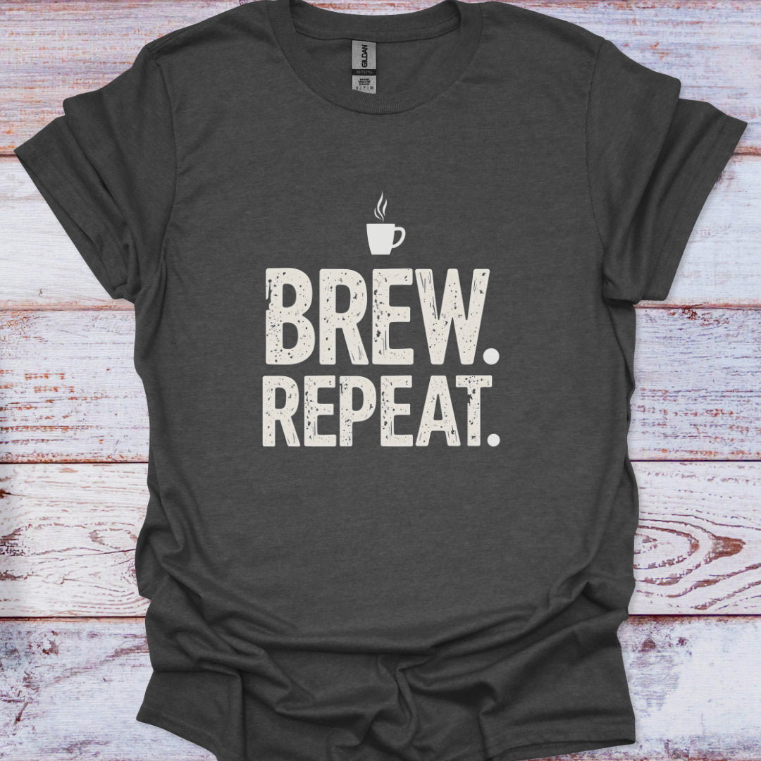 Dark gray t-shirt with 'Brew. Repeat.' text and coffee cup graphic on a wooden surface