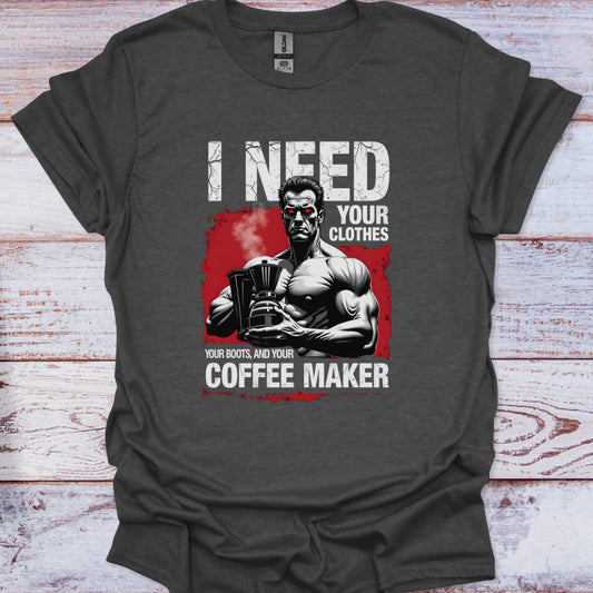 Gray t-shirt with graphic design of a muscular man holding a coffee maker and text on a wooden surface.