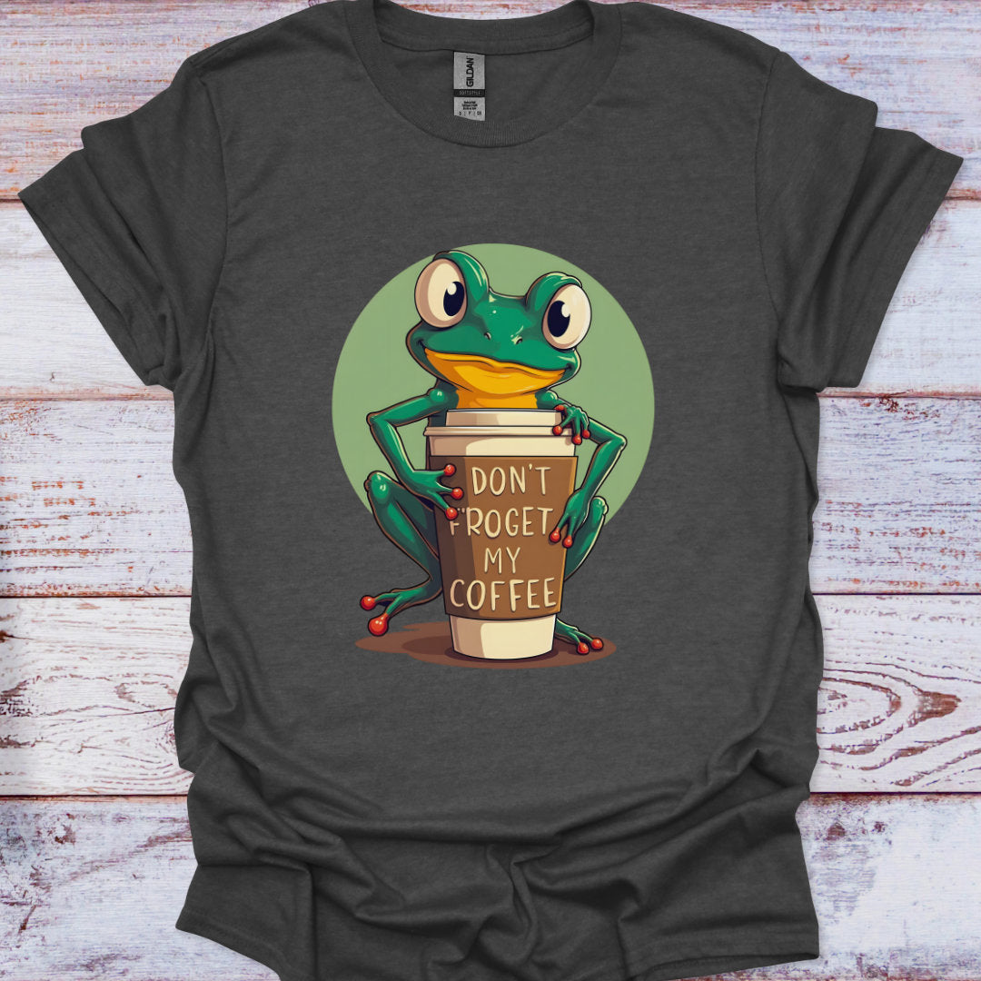 Dark gray t-shirt with a cartoon frog holding a coffee cup on a wooden surface