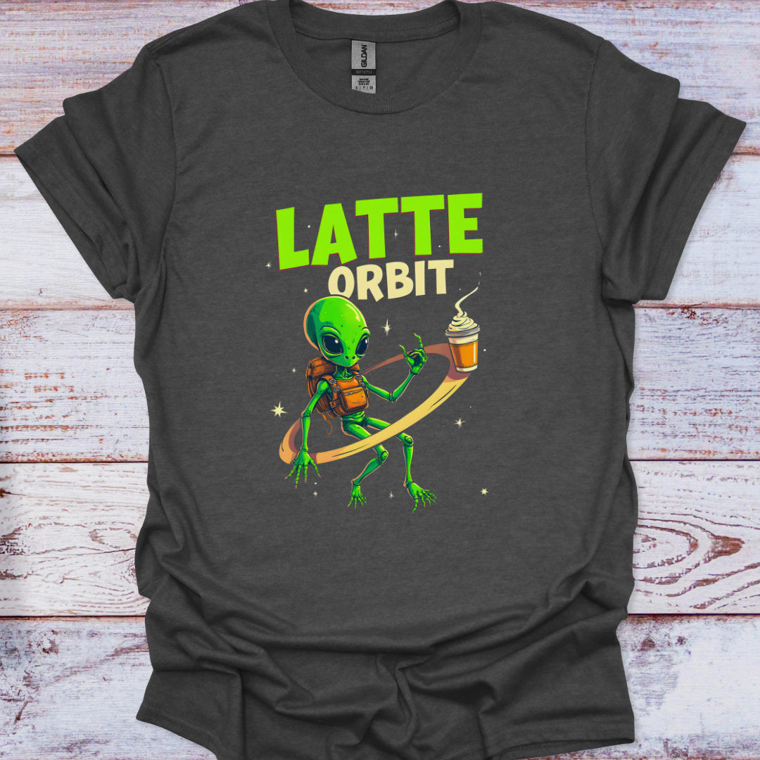 Dark gray t-shirt with a green alien holding a coffee cup and 'Latte Orbit' text on a wooden surface.