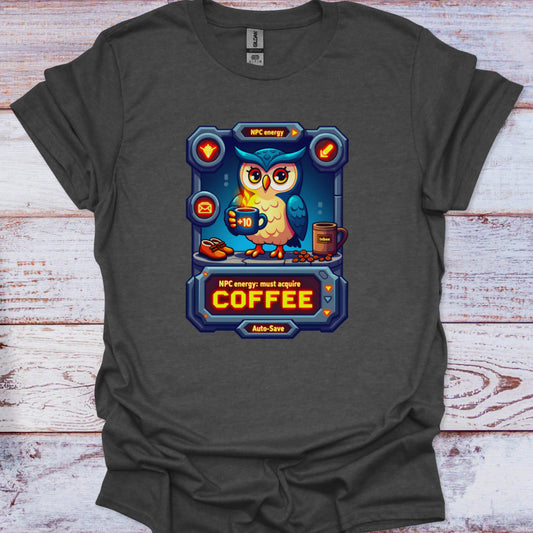 Dark gray t-shirt with a graphic of an owl holding a coffee cup on a wooden surface