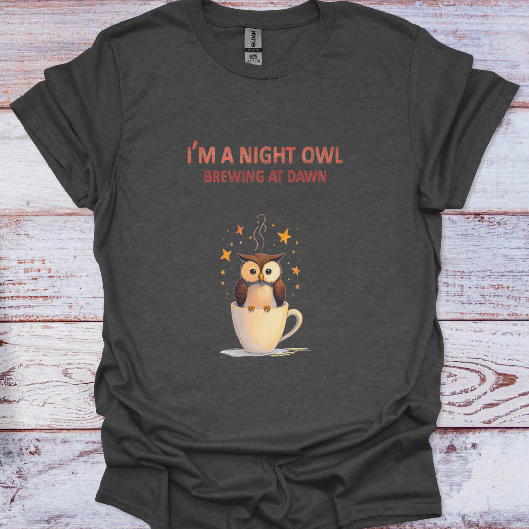 Dark gray t-shirt with an owl graphic and text on a wooden surface